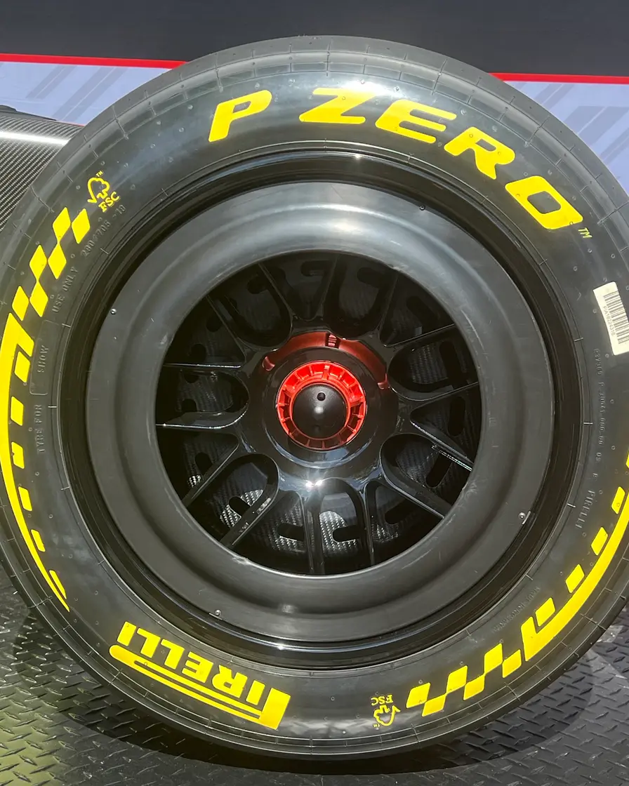 A Pirelli P Zero medium slick tyre on a Formula 1 car, with the yellow P Zero and Pirelli lettering on the sidewall